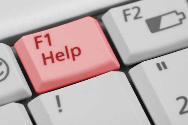 part of a keyboard with a red F1 button labeled "Help!"
